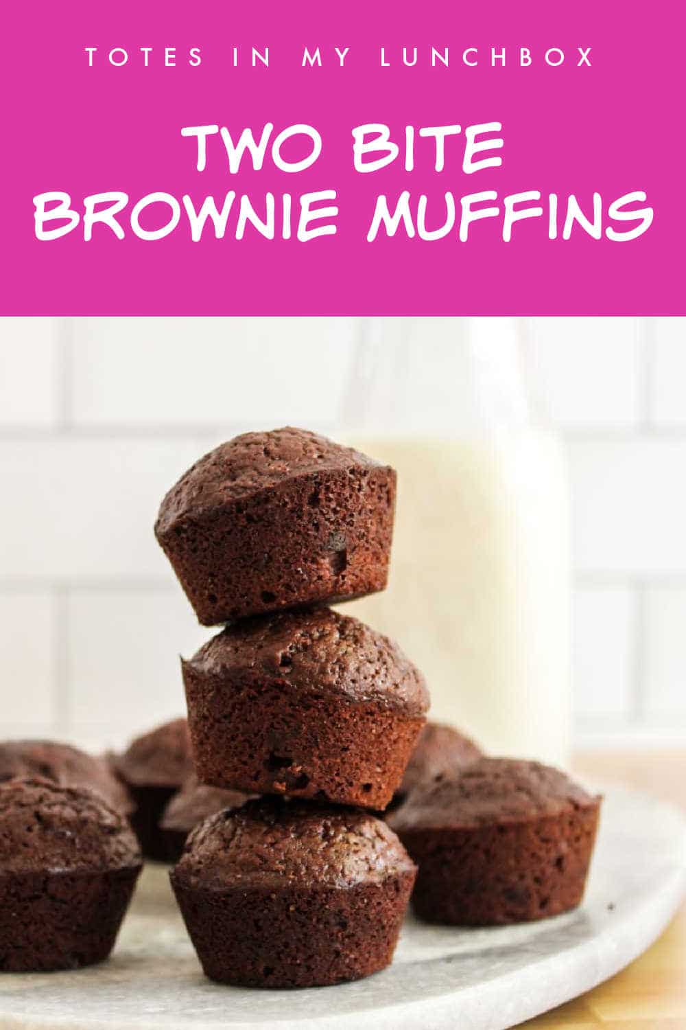 Two bite brownie muffins stacked on top of each other.
