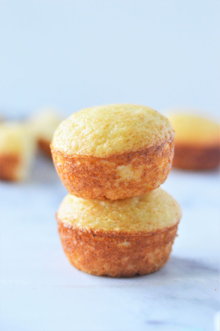 a stack of yogurt muffins against a light blue background
