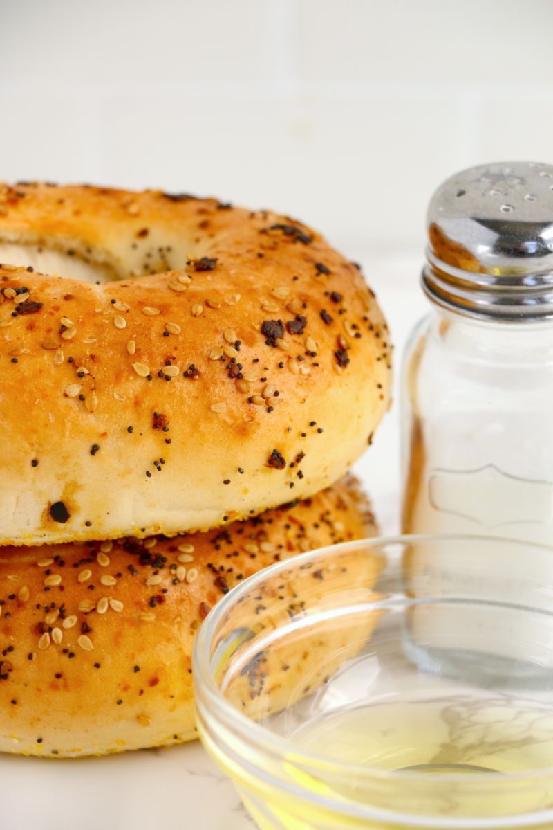 Ingredient shot containing bagels, olive oil and sea salt