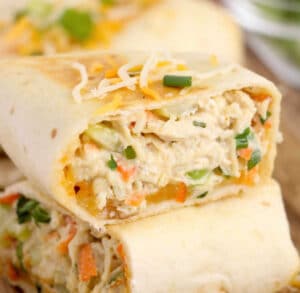 chicken salad wrap cut in half and stacked one on top of the other