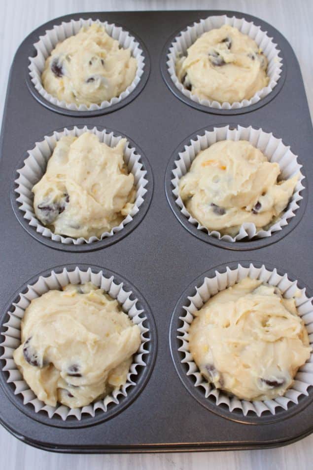 Muffin batter scooped into muffin liners