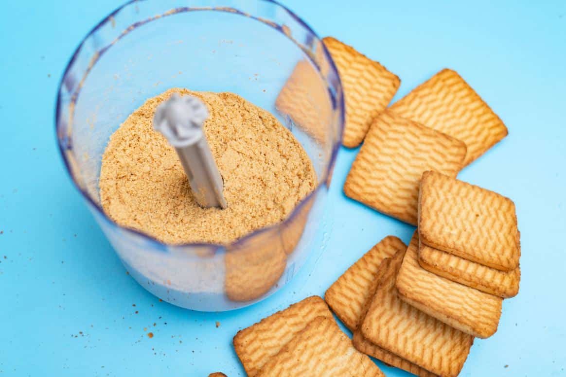 Process the plain biscuits until they resemble fine crumbs